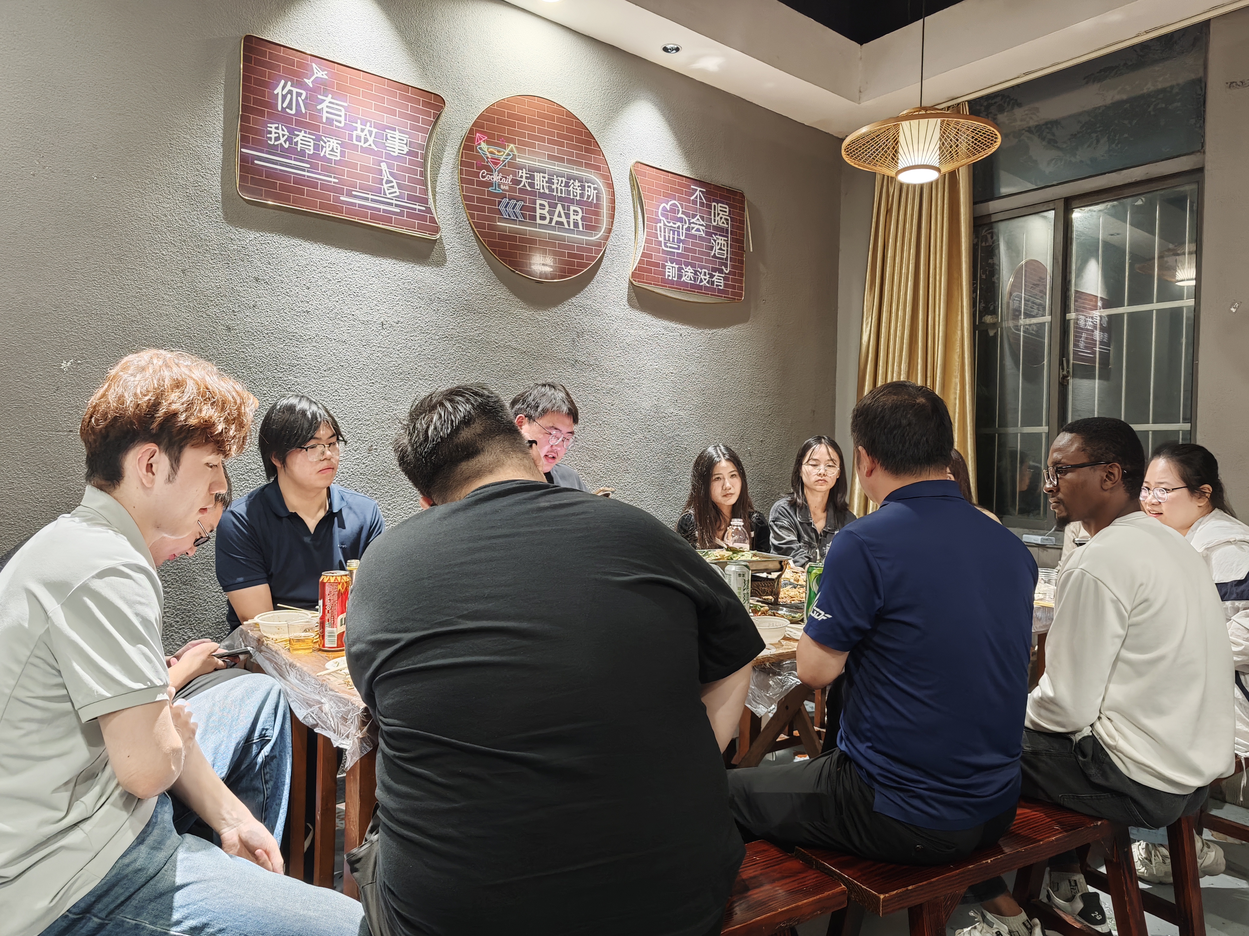 Lab members gathered around the dinner table